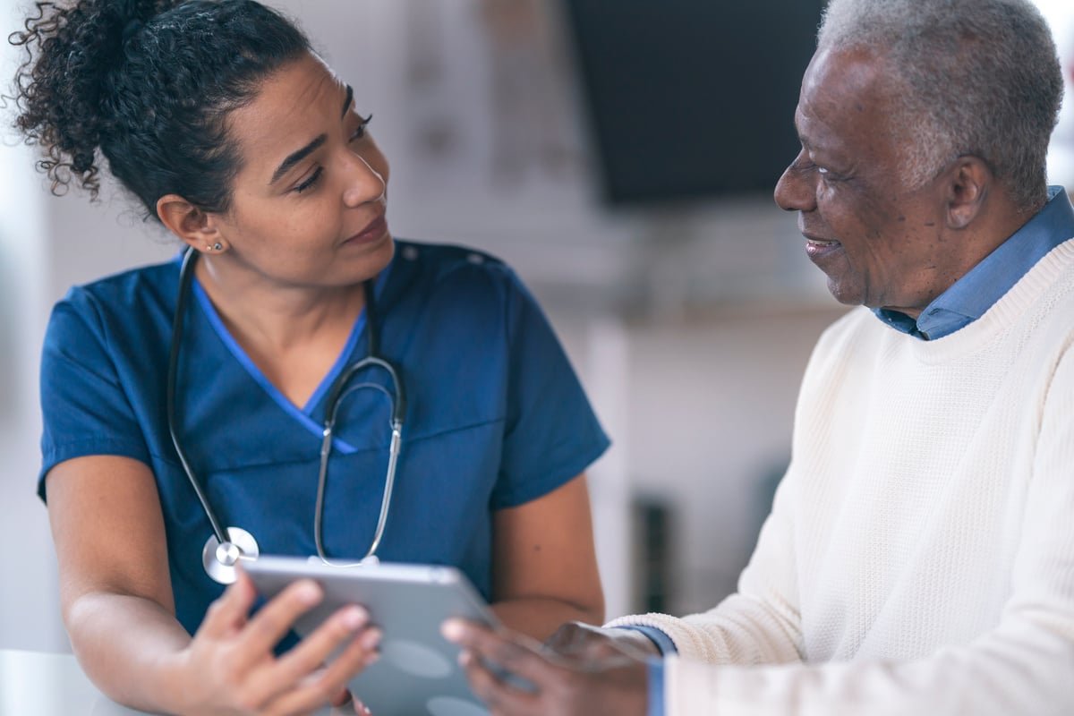 Female doctor consulting senior patient